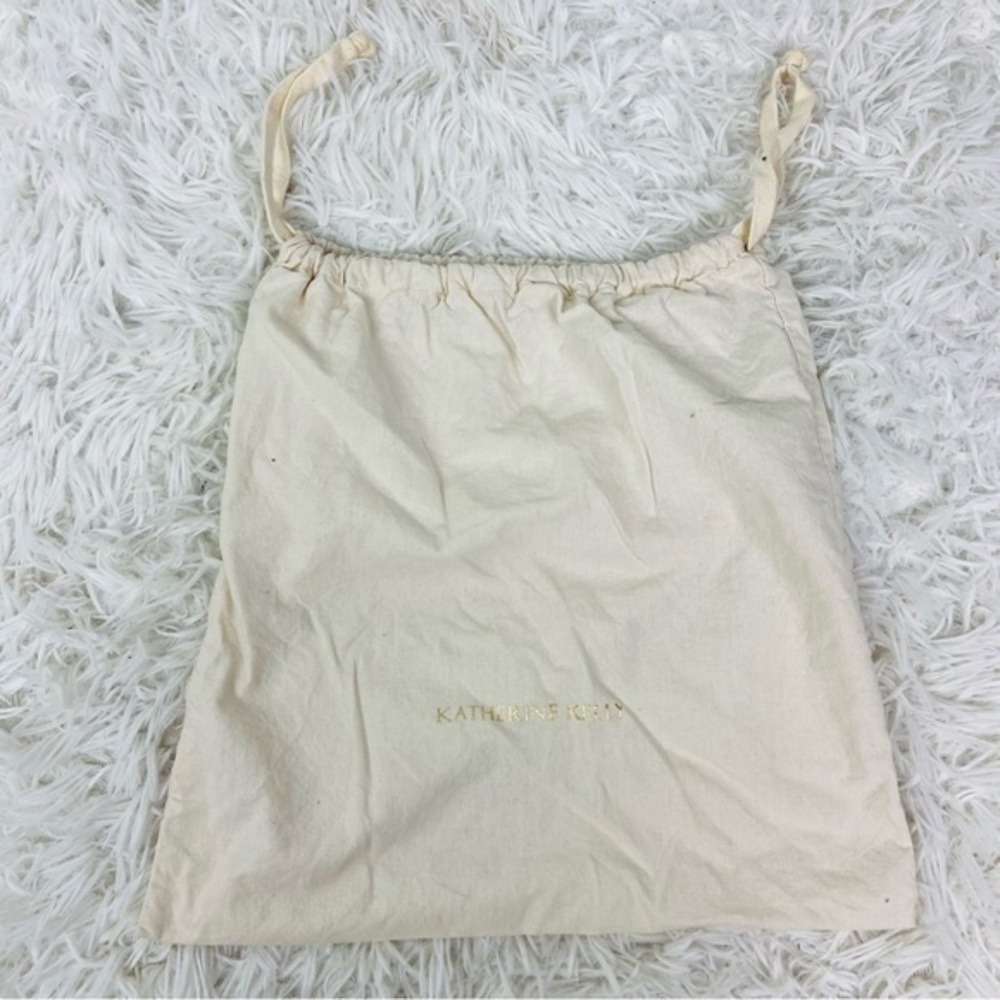KATHERINE KELLY cream draw string golden dust bag